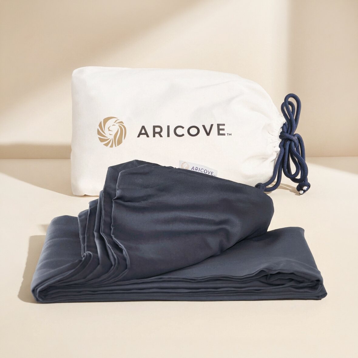 Aricove weighted blanket cover in charcoal grey, folded with storage bag
