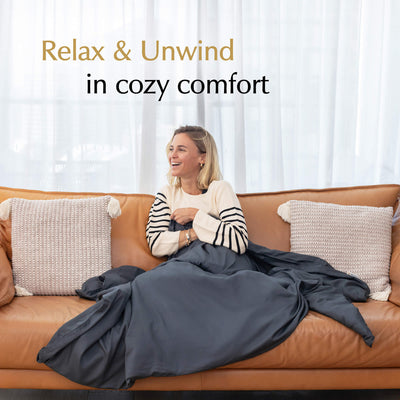relax and unwind in cozy comfort with weighted blanket cover charcoal grey on a couch#color_Charcoal-Grey