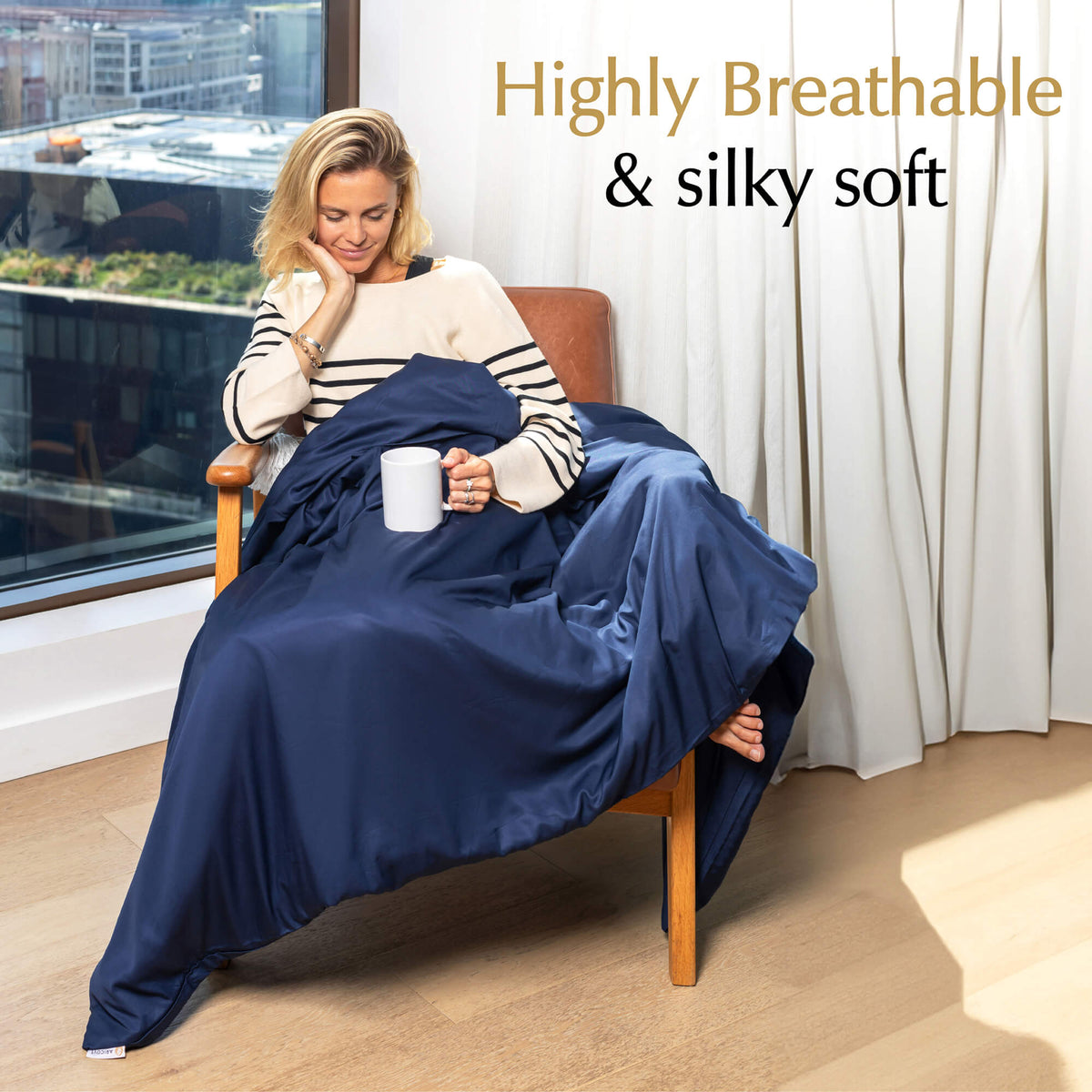 highly breathable and silky soft weighted blanket cover midnight blue on a chair