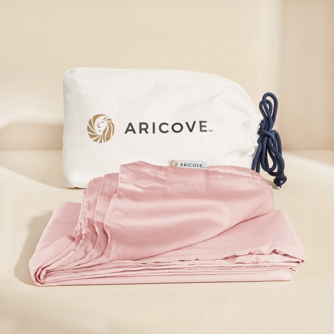 Aricove weighted blanket cover in pastel pink, folded with storage bag